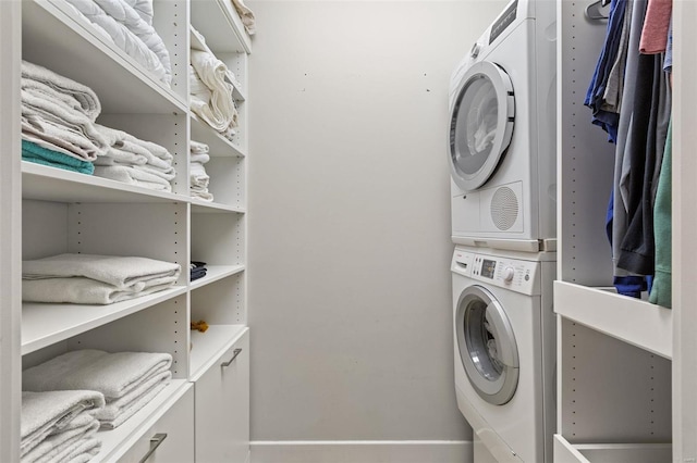 laundry room featuring stacked washer and clothes dryer