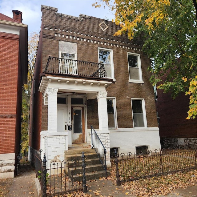 view of front of home with a balcony and a porch