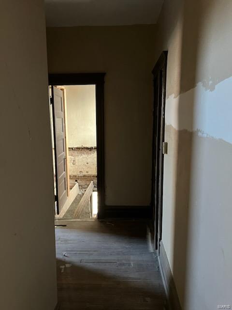 corridor featuring dark wood-type flooring