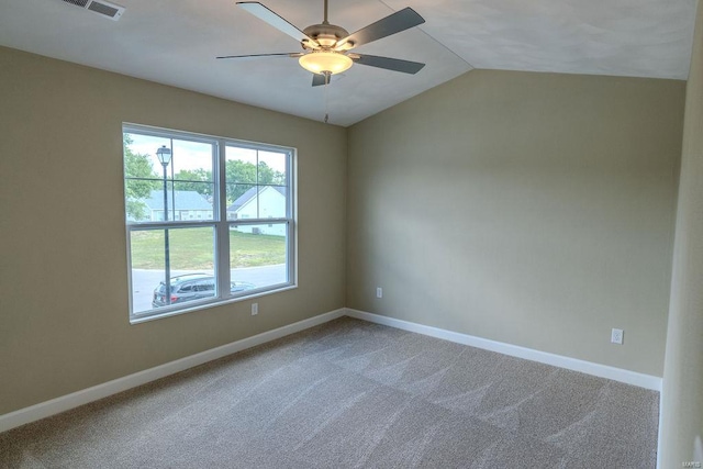 unfurnished room with lofted ceiling, ceiling fan, and carpet floors