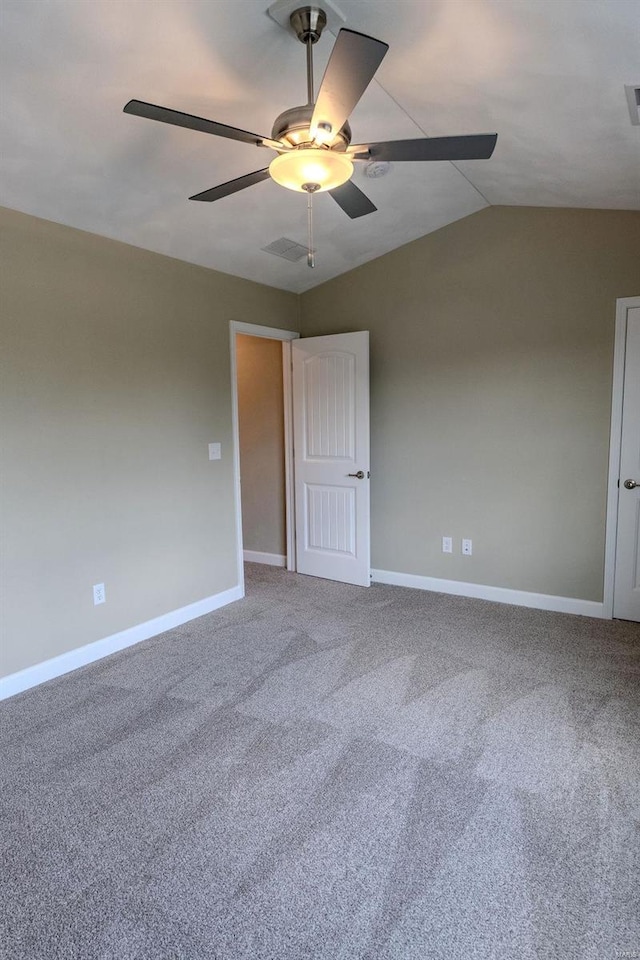 unfurnished room with carpet floors, lofted ceiling, and ceiling fan