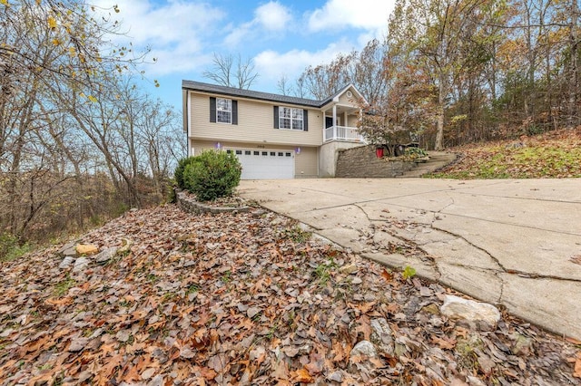 view of front of property with a porch and a garage