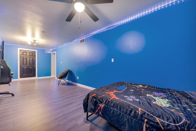 bedroom with hardwood / wood-style flooring and ceiling fan