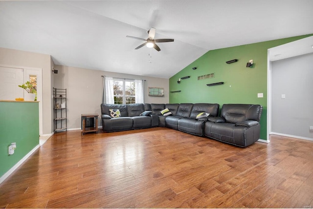 living room with lofted ceiling, wood-type flooring, and ceiling fan