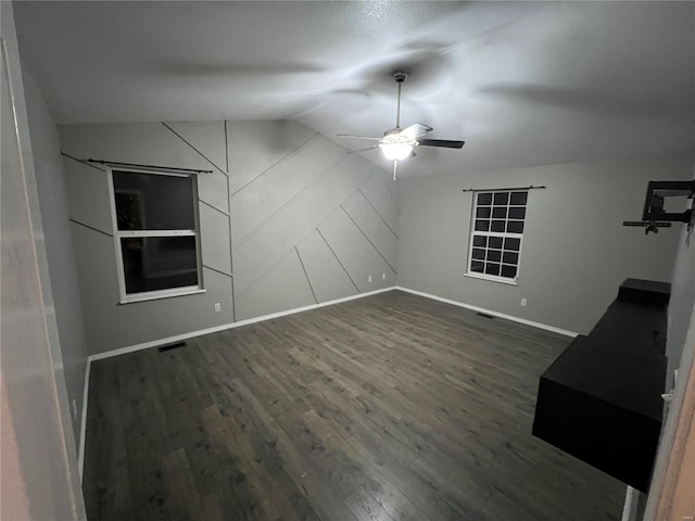 interior space featuring vaulted ceiling and dark hardwood / wood-style floors