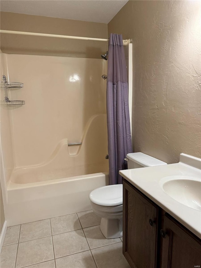 full bathroom with vanity, shower / bath combo, tile patterned flooring, and toilet