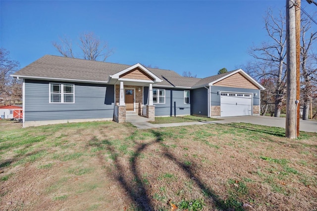 view of front of home with a garage and a front lawn