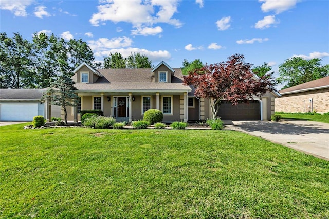 view of front of property with covered porch, a front yard, and a garage