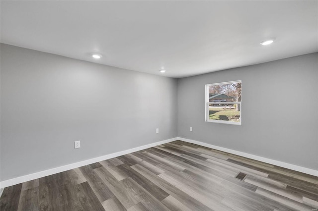 unfurnished room featuring wood-type flooring