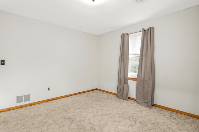 empty room featuring light colored carpet