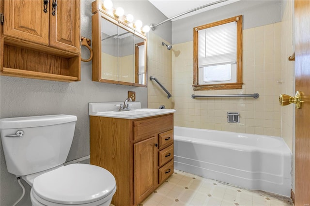 full bathroom with vanity, toilet, and tiled shower / bath