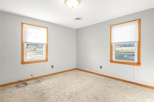 unfurnished room featuring carpet