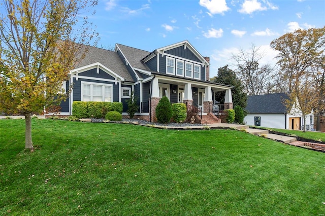 craftsman-style house with a front yard and a porch