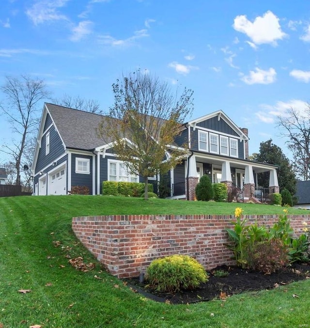 view of front facade with a front lawn and a garage