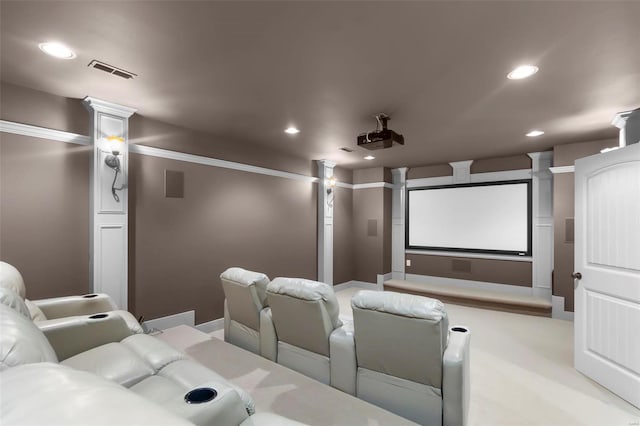 cinema room with light colored carpet