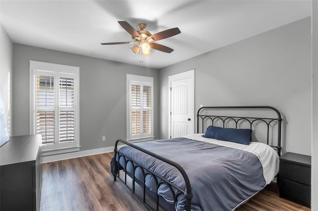 bedroom featuring ceiling fan and dark wood-type flooring