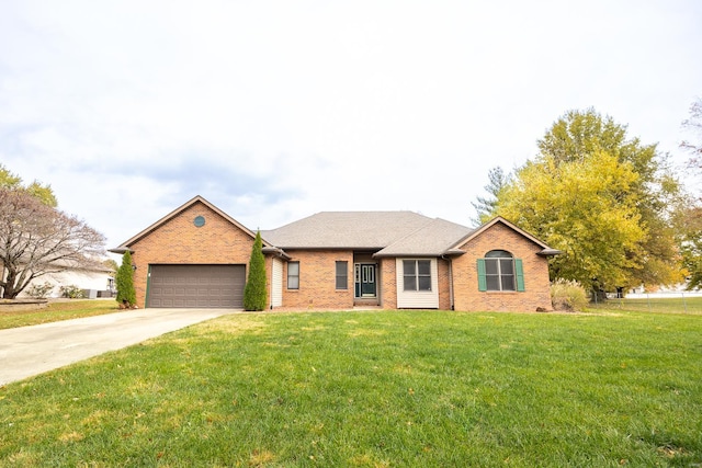 ranch-style home with a garage and a front lawn