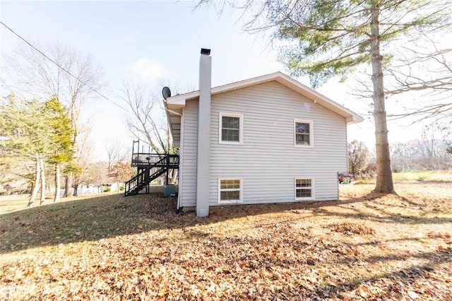 view of side of property with a wooden deck