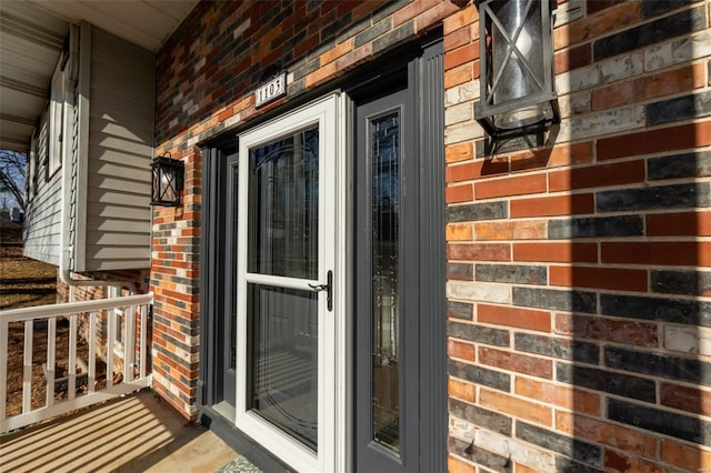 entrance to property featuring covered porch