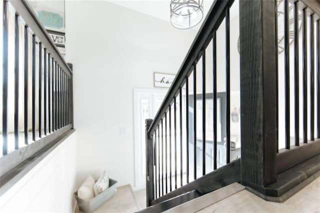 staircase with a wealth of natural light