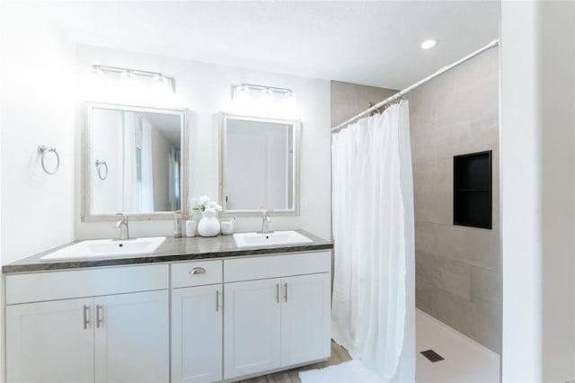 bathroom with vanity and walk in shower