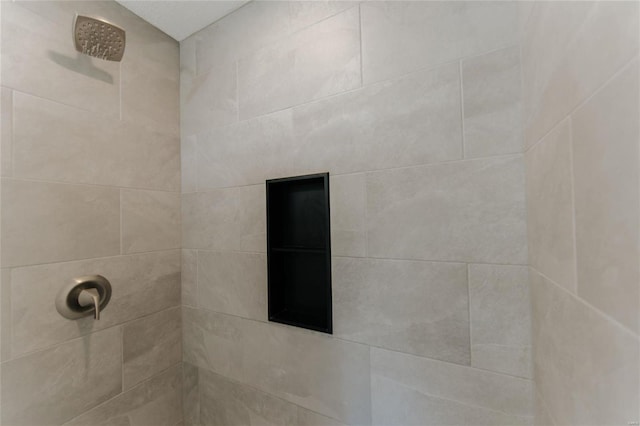 bathroom with a tile shower