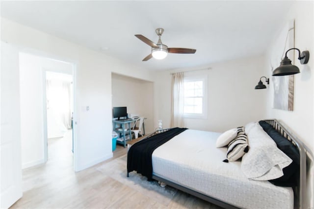 bedroom featuring light wood-type flooring and ceiling fan