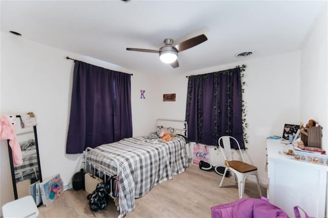 bedroom featuring light wood-type flooring and ceiling fan