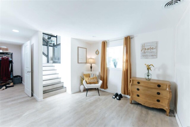 sitting room with light hardwood / wood-style floors