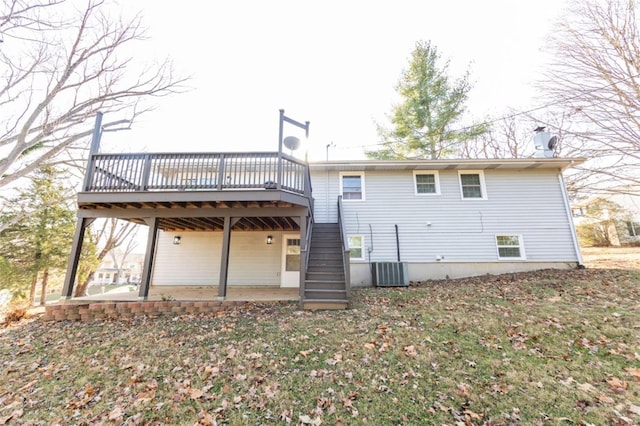 back of house featuring a patio and a deck