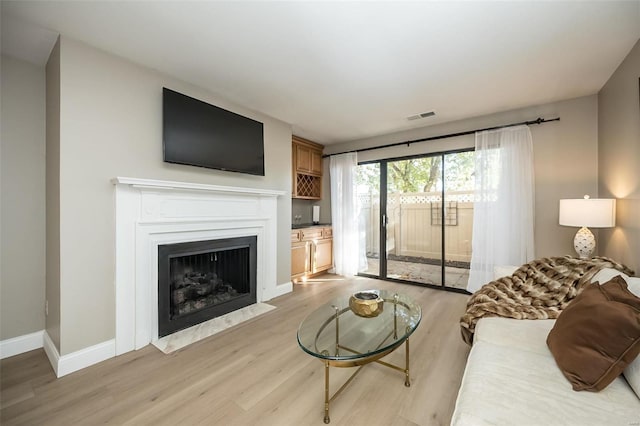 living room with light hardwood / wood-style floors