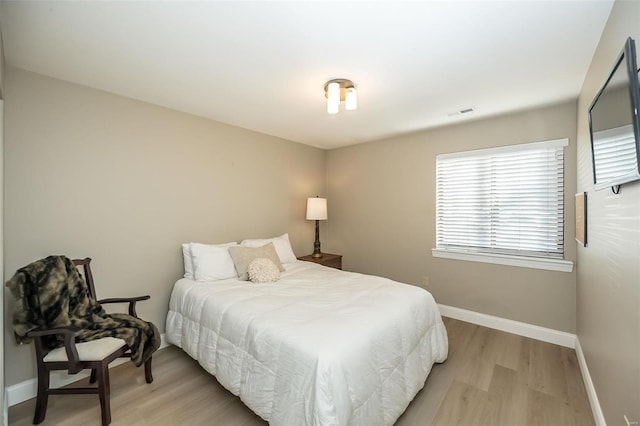 bedroom featuring light hardwood / wood-style floors