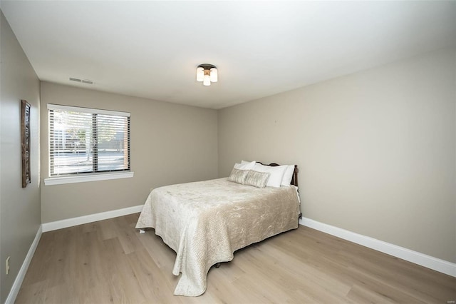 bedroom featuring light hardwood / wood-style floors