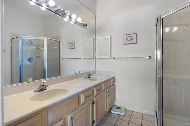 bathroom featuring walk in shower, vanity, and tile patterned flooring