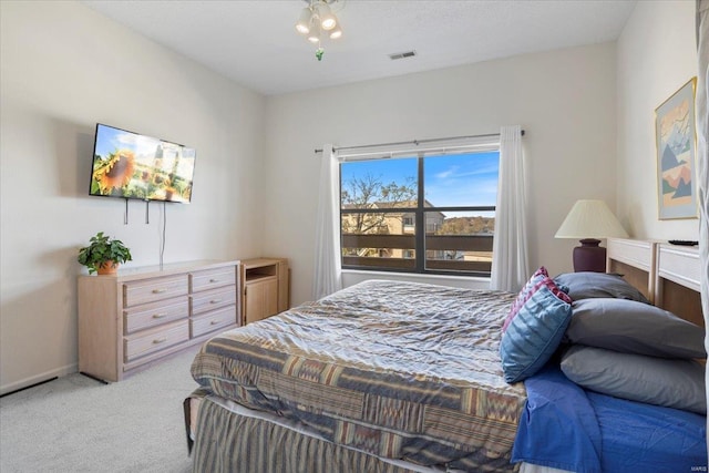 bedroom with light colored carpet