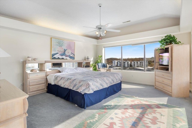 carpeted bedroom featuring vaulted ceiling and ceiling fan