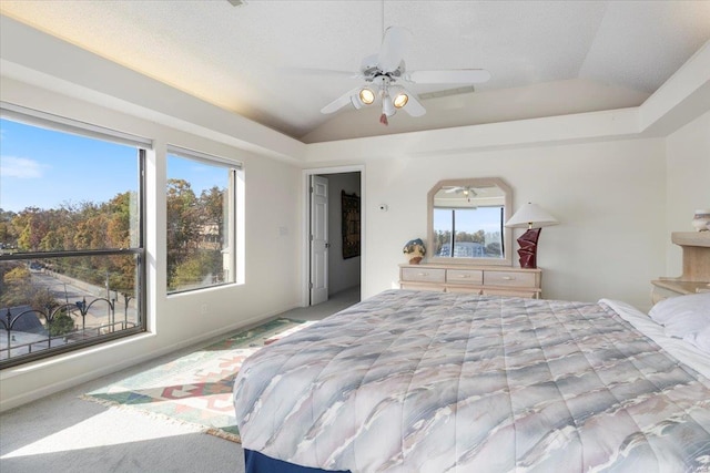 bedroom featuring light carpet, ceiling fan, and lofted ceiling