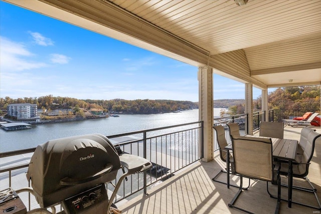 balcony featuring a water view and area for grilling