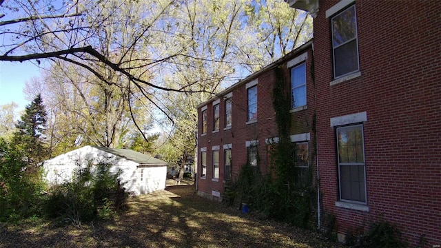 view of property exterior with an outbuilding