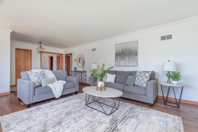 living room with crown molding and dark wood-type flooring