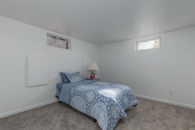 bedroom featuring light carpet