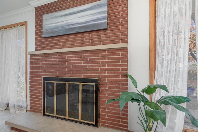 details with carpet flooring, crown molding, and a fireplace