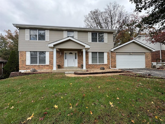 front facade with a garage, a front lawn, and covered porch