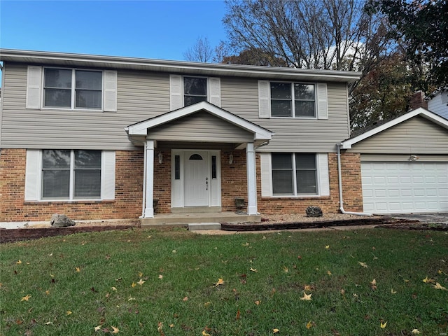 view of front of property featuring covered porch, a garage, and a front yard