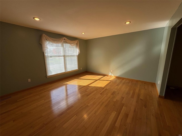 empty room featuring hardwood / wood-style flooring