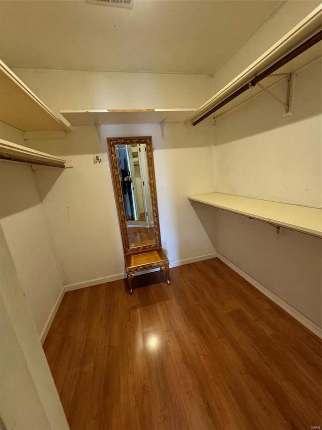 walk in closet featuring hardwood / wood-style floors