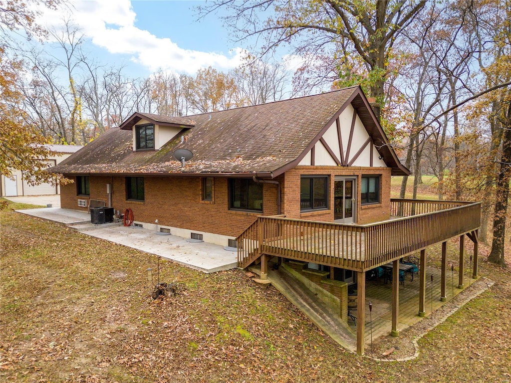 back of house featuring a patio, a deck, and central AC unit