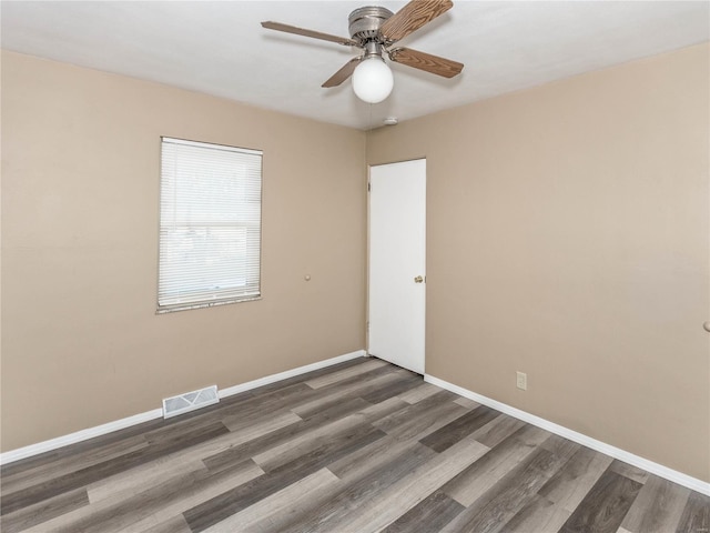 unfurnished room featuring ceiling fan and dark hardwood / wood-style floors