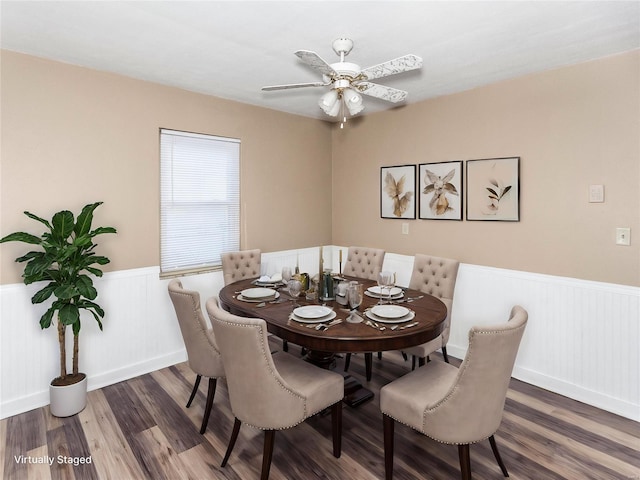 dining space with ceiling fan and dark hardwood / wood-style flooring