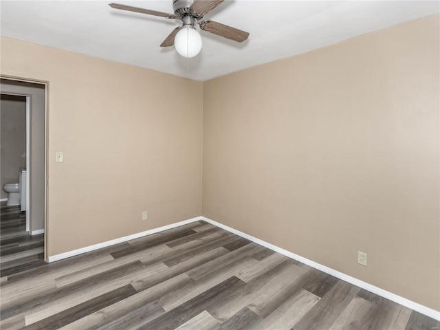 empty room featuring dark hardwood / wood-style flooring